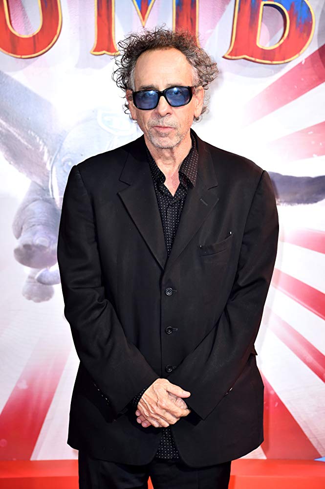 man in sunglasses and black suit