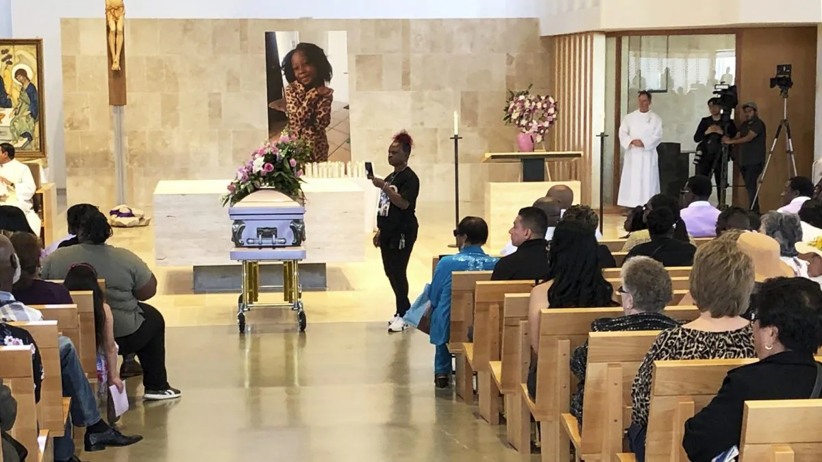 Mourners gather for the funeral service of Trinity Love Jones, the 9-year-old whose body was found this month stuffed in a duffel bag along an equestrian trail, at St. John Vianney Catholic Church in Hacienda Heights, Calif., on March 25, 2019. (John Rogers/AP Photo)