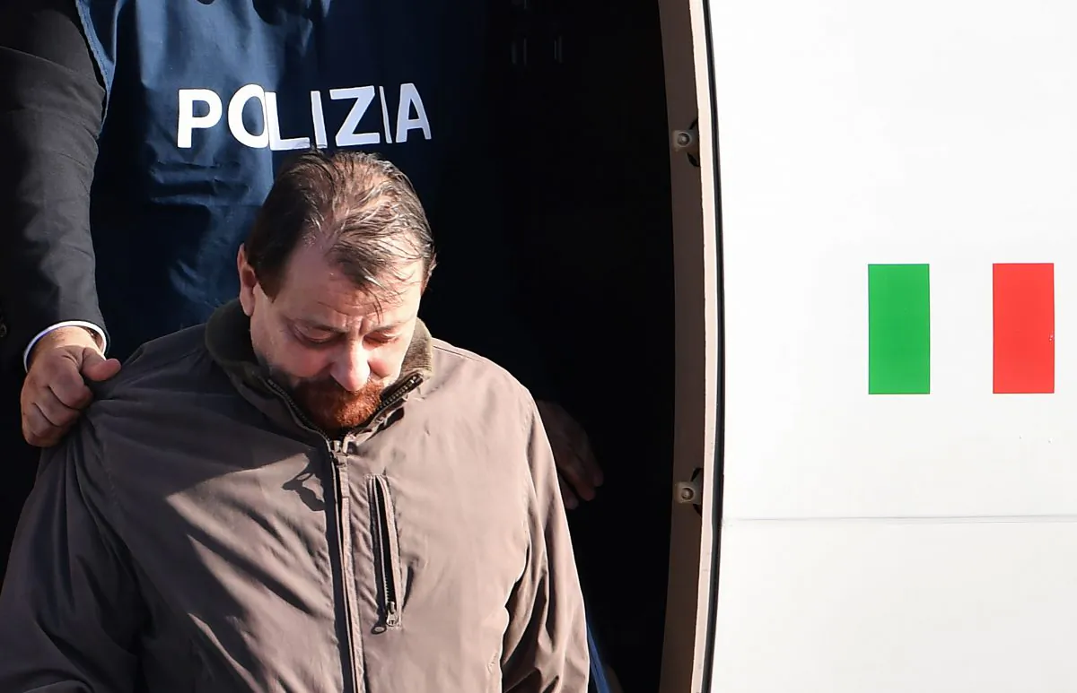 Italian communist militant Cesare Battisti steps off a plane coming from Bolivia in Rome on Jan. 14, 2019. (Alberto Pizzoli/AFP/Getty Images)