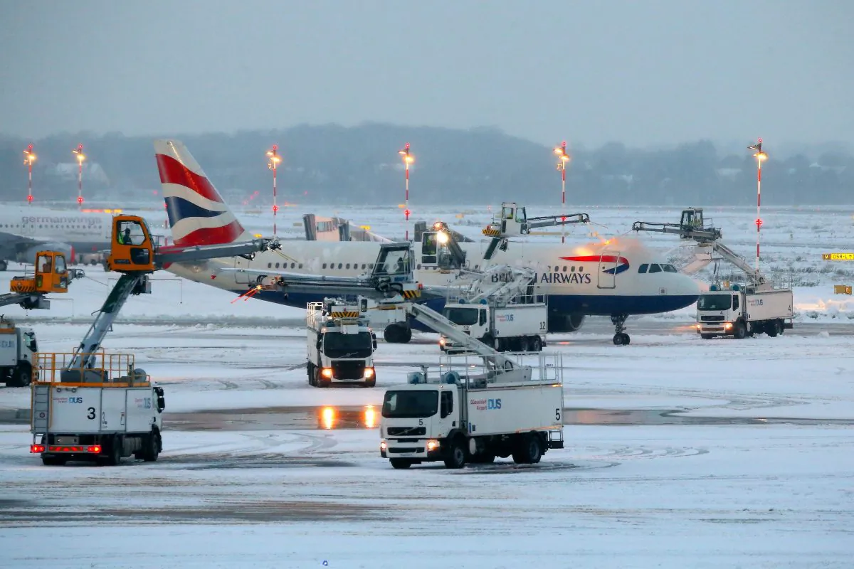 An airplane of British Airways is being de-iced as it stands on the tarmac of the airport in Duesseldorf, western Germany, on Dec. 10, 2017. (David Young/AFP/Getty Images))