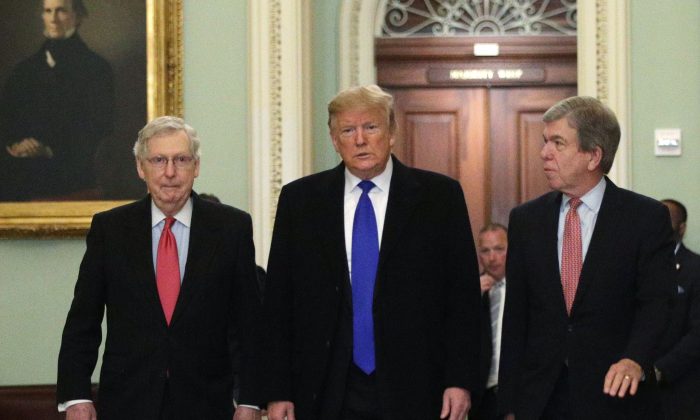 Then-President Donald Trump (C) walks with Senate GOP  Leader Sen. Mitch McConnell (R-Ky.) (L), and Sen. Roy Blunt (R-Mo.) (R) as he arrives at the Capitol on March 26, 2019. (Alex Wong/Getty Images)