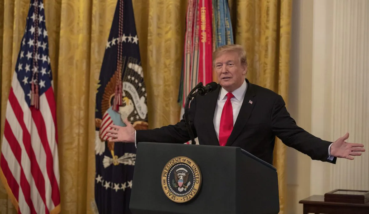 President Donald Trump presents the Medal of Honor to Trevor Oliver, son of Staff Sergeant Travis W. Atkins, at the White House, on March 27, 2019. (Tasos Katopodis/Getty Images)