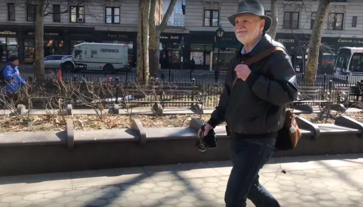 Photographer Herb Bardavid walking on the street of the Upper West Side, New York City on March 9, 2019 (Penny Zhou/The Epoch Times)