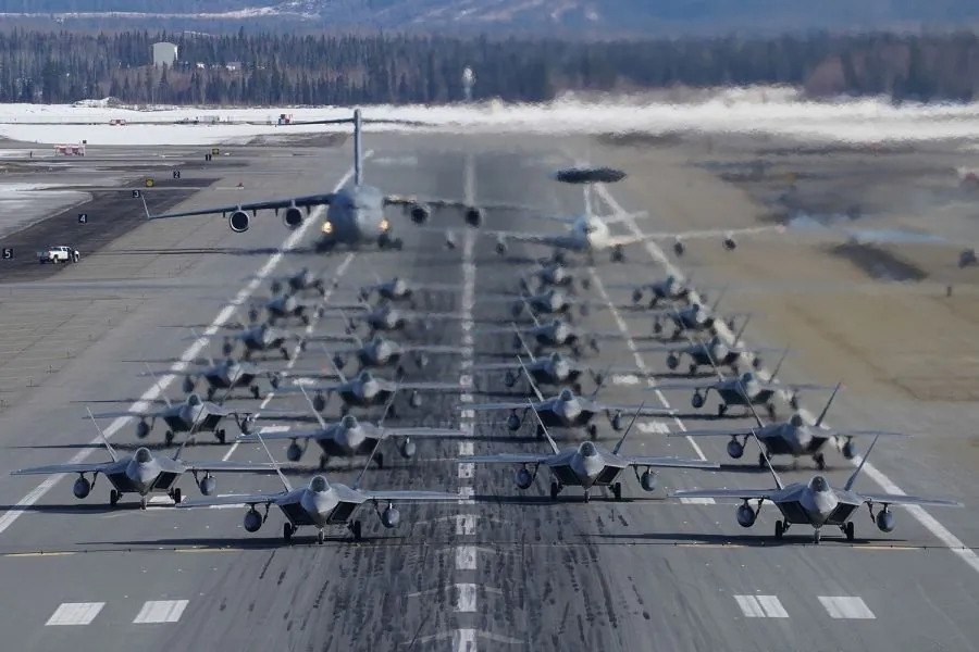 F-22 Raptors participate in an elephant walk with an E-3 Sentry and a C-17 Globemaster III at Joint Base Elmendorf-Richardson, Alaska, on March 26, 2019. (US Air Force)