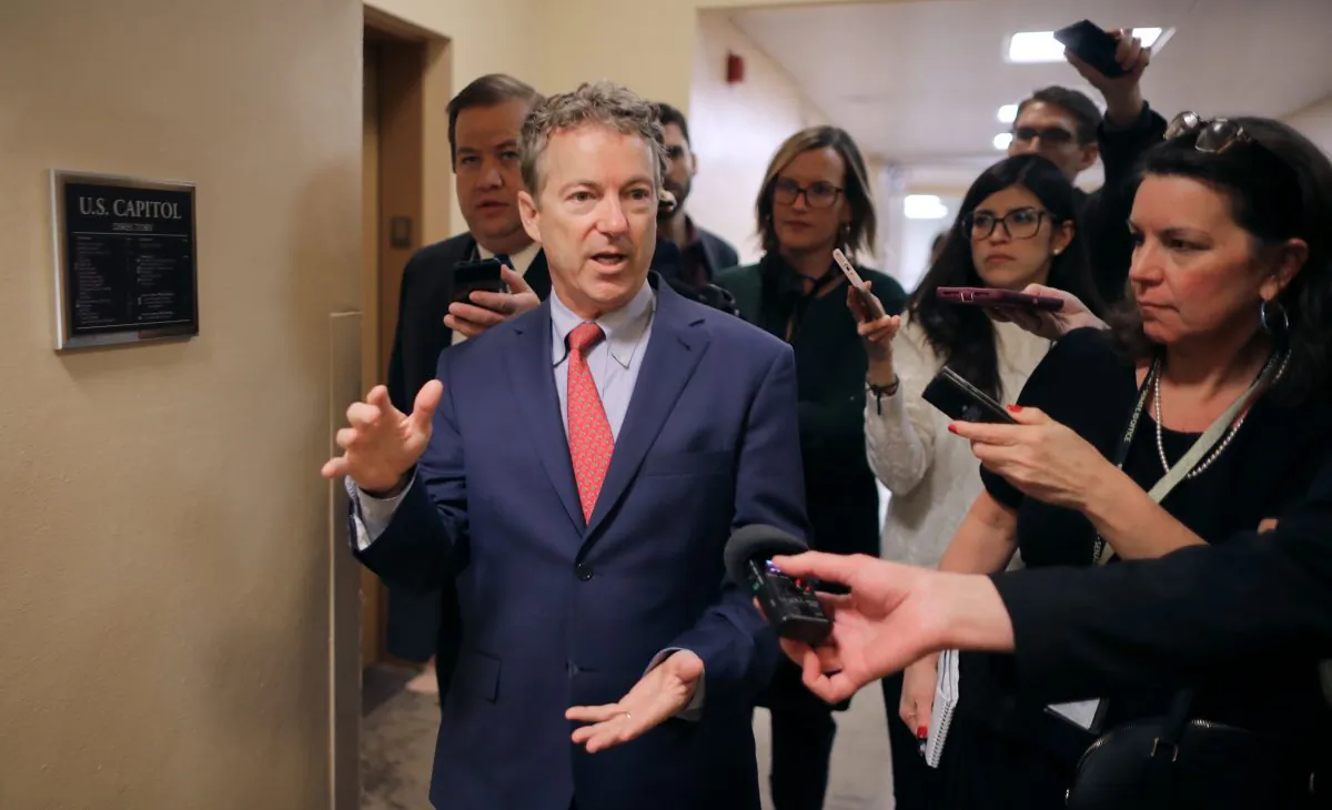 Sen. Rand Paul (R-Ky.) talks to reporters as he heads to the U.S. Capitol for the weekly Republican policy luncheon on March 5, 2019. (Chip Somodevilla/Getty Images)