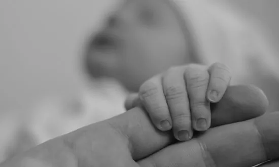 Candid Photos of Brazilian Father Praying at Newborn Son’s Bedside Go Viral