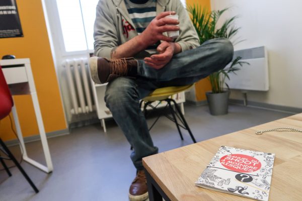 Loic, a drug user, speaks to a journalist