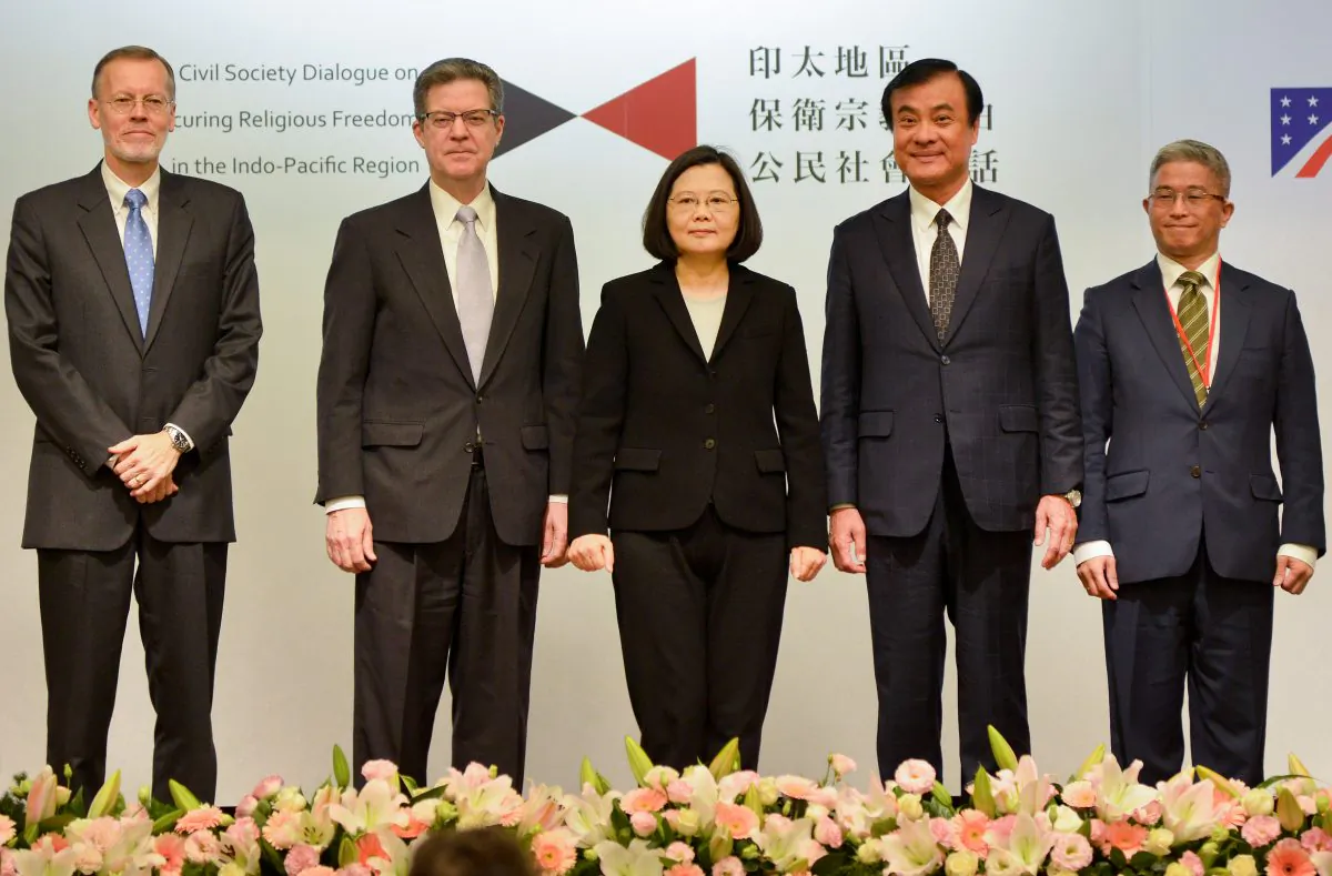 Taiwanese President Tsai Ing-wen (C) and Sam Brownback (2nd L), the U.S. ambassador at large for religious freedom, stand on the stage during the Indo-Pacific forum on religious freedom in Taipei on March 11, 2019. (Chris Stowers/AFP/Getty Images)