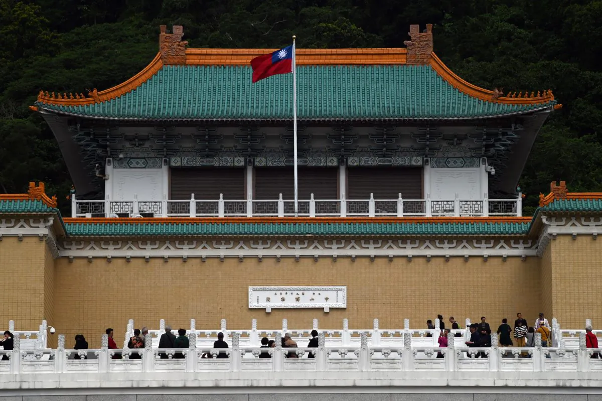 Tourists walk in front of Taiwan's National Palace Museum in Taipei on March 13, 2019. (Sam Yeh/AFP)