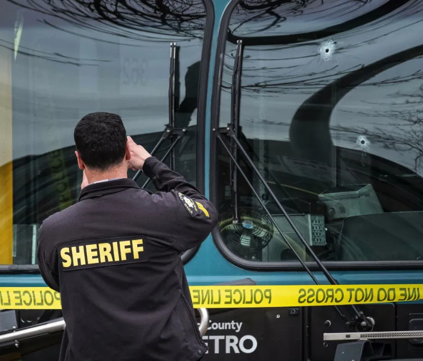 Several bullet holes can be seen in the driver's side window of a metro Bus after a shooting in beattle, on March 27, 2019. (Dean Rutz/The Seattle Times via AP)