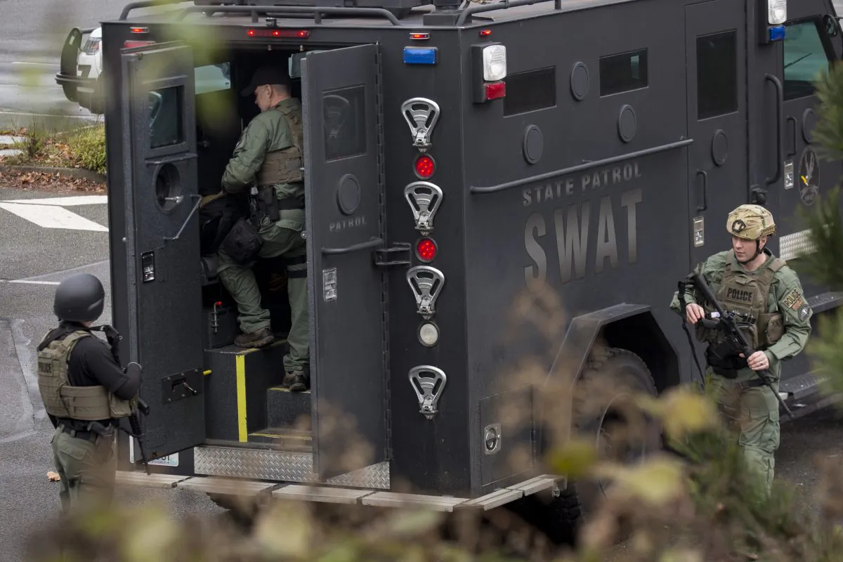 In this file photo, members of a SWAT team work in a parking lot in Des Moines, Wash., on Feb. 16, 2018. (David Ryder/Getty Images)