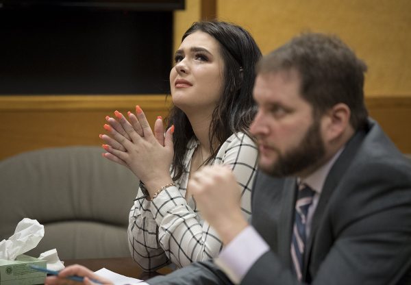 Taylor Smith reacts in court