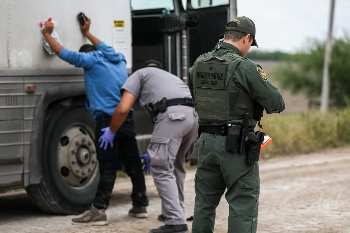 Border Patrol agents apprehend illegal aliens who have just crossed the Rio Grande from Mexico into Penitas, Tex., on March 21, 2019. (Charlotte Cuthbertson/The Epoch Times)