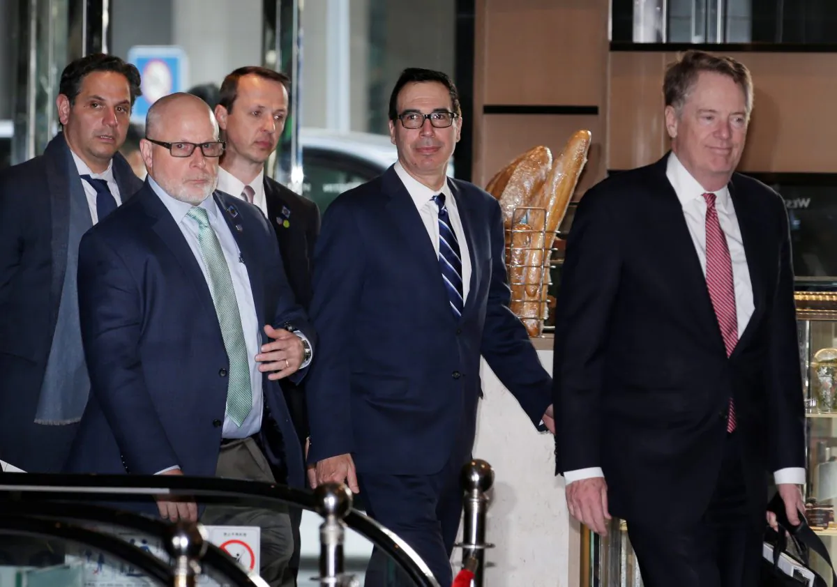 Members of the U.S. trade delegation Robert Lighthizer and Steven Mnuchin arrive at a hotel in Beijing on March 28, 2019. (Jason Lee/Reuters)