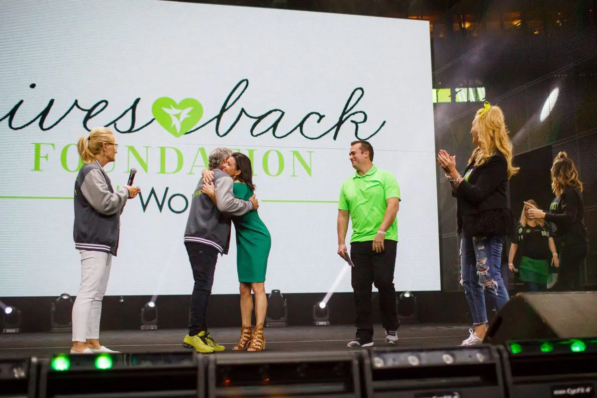 Elizabeth Melendez Fisher (C) at the international It Works Conference. (Courtesy of Elizabeth Melendez Fisher)