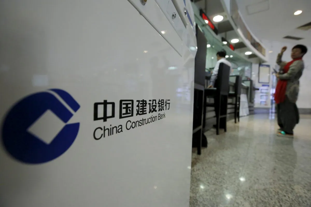 A customer waits at a counter of a branch of China Construction Bank Corp (CCB) at its headquarters in Beijing on March 31, 2016. (Kim Kyung-Hoon/Reuters)
