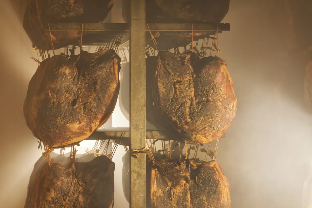 The gentle smoking process for Speck Alto Adige consists of five hours of smoke followed by five hours of fresh mountain air, over the course of a week. (Frieder Blickle)