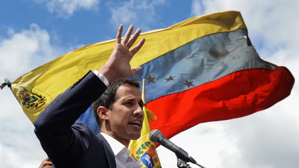 Venezuela's National Assembly head Juan Guaido speaks to the crowd during a mass opposition rally against leader Nicolas Maduro in which he declared himself the country's acting president, on the anniversary of a 1958 uprising that overthrew a military dictatorship, in Caracas on Jan. 23, 2019. (Federico Parra/AFP) 