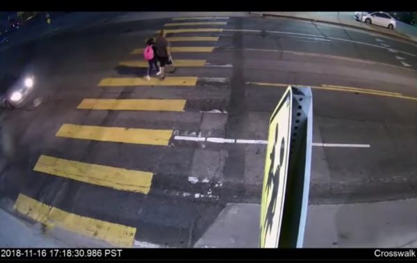man and daughter on crosswalk