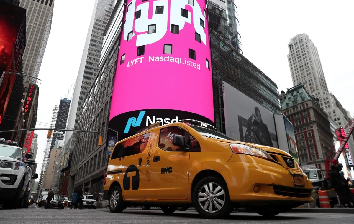 Signage for Lyft is seen displayed at the NASDAQ MarketSite in Times Square in celebration of its initial public offering (IPO) on the NASDAQ Stock Market in New York on March 29, 2019. (Shannon Stapleton/Reuters)