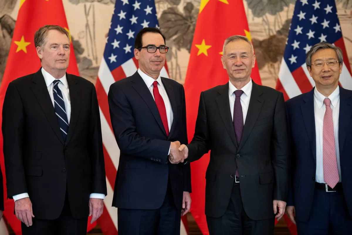 China's Vice Premier Liu He shakes hands with U.S. Treasury Secretary Steven Mnuchin as Yi Gang, governor of the People's Bank of China (PBC) and U.S. Trade Representative Robert Lighthizer stand next to them as they pose for a group photo at Diaoyutai State Guesthouse in Beijing on March 29, 2019. (Nicolas Asfouri/Pool via Reuters)