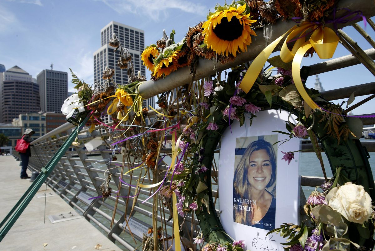flowers and a portrait of Kate Steinle