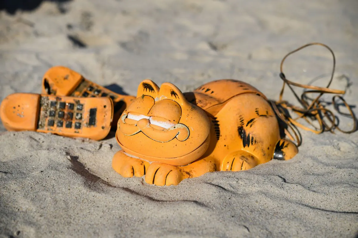 Novelty plastic 'Garfield' phones washed-up on the beach in Plouarzel, France, on March 28, 2019. (Fred Tanneau/AFP/Getty Images)