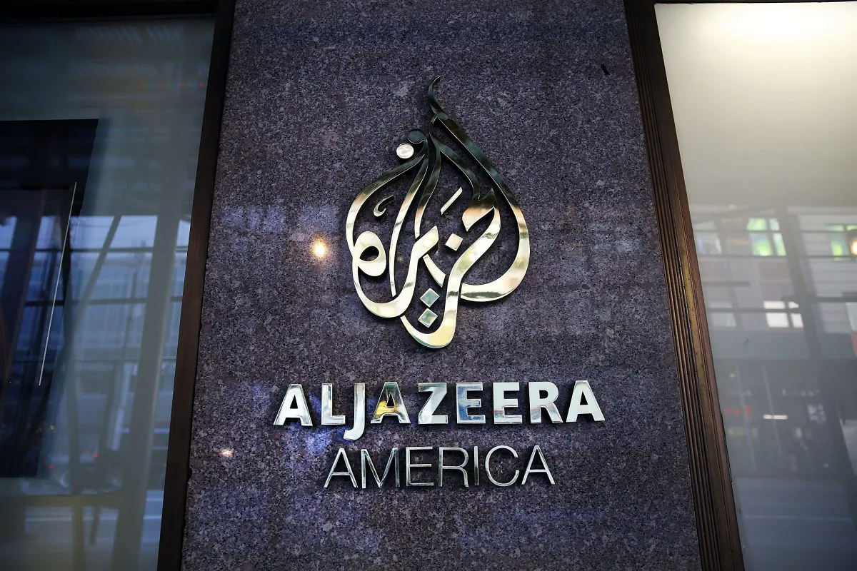 The logo for Al Jazeera America is displayed outside of the cable news channel's offices in New York City on Jan. 13, 2016. (Spencer Platt/Getty Images)