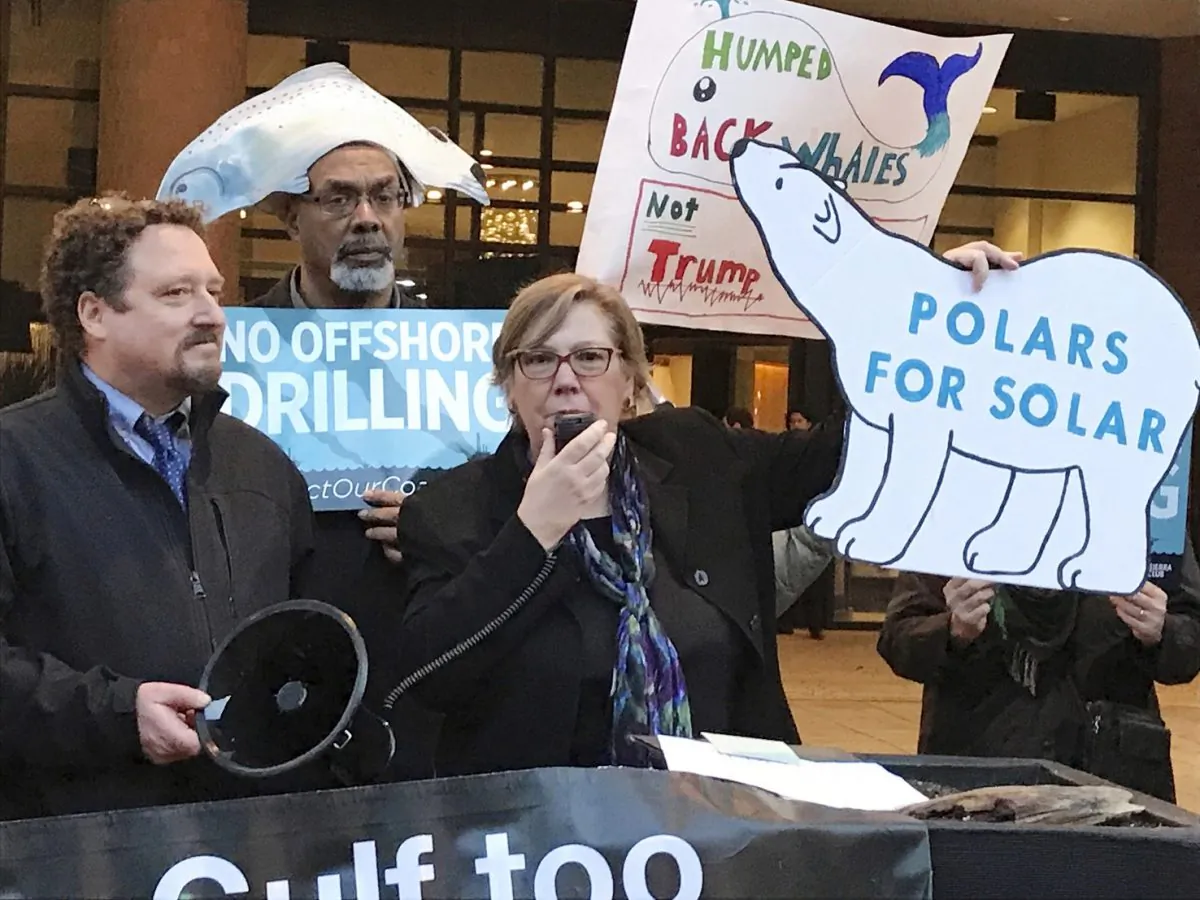 Judith Enck, center, former regional administrator for the Environmental Protection Agency addresses those gathered at a protest against President Trump's plan to expand offshore drilling for oil and gas in Albany, N.Y. on Feb. 15, 2018.  (AP Photo/David Klepper, File)