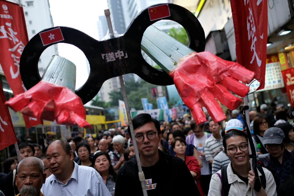 Demonstrators march during a protest to demand authorities scrap a proposed extradition bill with China, in Hong Kong, China on March 31, 2019. (Reuters/Tyrone Siu)