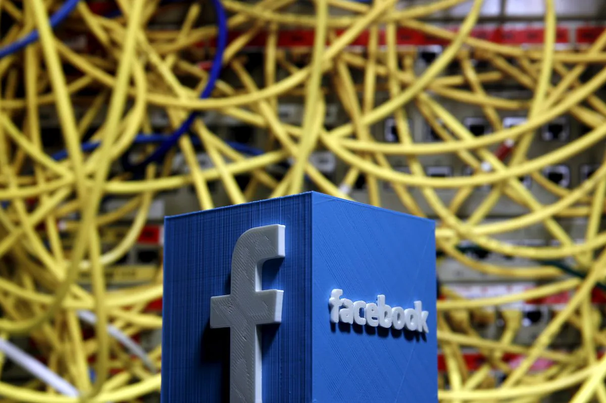 A 3D plastic representation of the Facebook logo is seen in front of displayed cables in this illustration in Zenica, Bosnia and Herzegovina, on May 13, 2015. (Dado Ruvic/File Photo via Reuters)