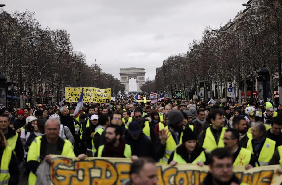 Yellow vest protesters march on the Champs Elysees avenue in Paris on March 2, 2019. AP Photo/Kamil Zihnioglu, File