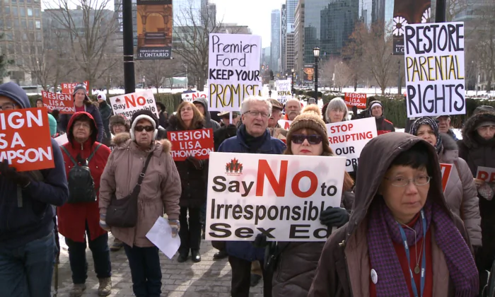 People gather to call on Premier Doug Ford to keep his promise to repeal the controversial 2015 sex education curriculum at Queen’s Park in Toronto on Feb. 2, 2019. (NTD Television)
