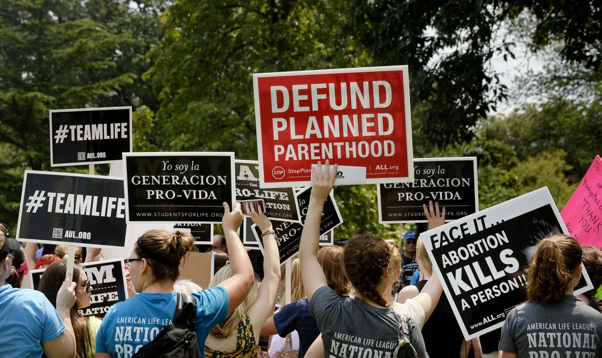 Activists hold a rally opposing federal funding for Planned Parenthood in front of the Capitol in Washington on July 28, 2015. (Olivier Douliery/Getty Images)