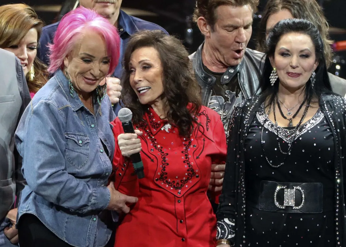 Loretta Lynn, center, Tanya Tucker, left, and Crystal Gayle perform at Loretta Lynn's 87th Birthday Tribute at Bridgestone in Nashville, Tenn. Arena, on April 1, 2019. (Al Wagner/Invision/AP)