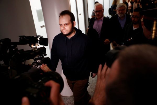 Joshua Boyle walks through the Toronto Pearson International Airport
