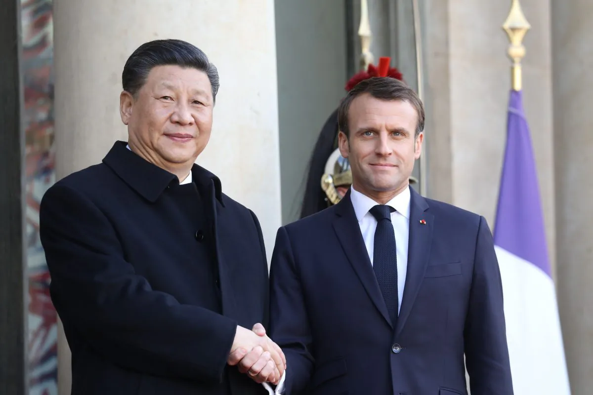 French President Emmanuel Macron (R) welcomes his Chinese counterpart Xi Jinping at the Elysee Palace in Paris on March 25, 2019. Chinese leader Xi Jinping is on a three-day state visit in France where he is expected to sign a series of bilateral and economic deals on energy, the food industry, transport, and other sectors. (Ludovic Marin/AFP/Getty Images)