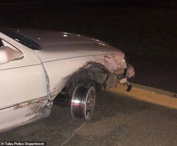 car with missing tire