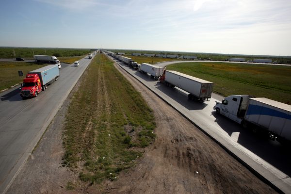Trucks wait in a long queue for border customs control to cross into U.S. at the World Trade Bridge in Nuevo Laredo