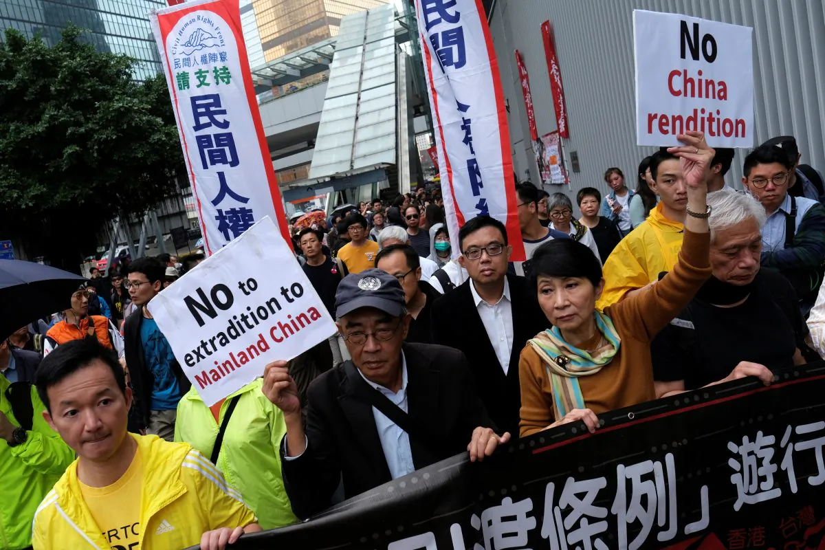 Demonstrators march during a protest to demand authorities to scrap a proposed extradition bill with China in Hong Kong, China on March 31, 2019. (Tyrone Siu/Reuters)
