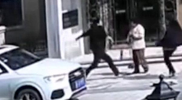 Woman hit by car and beat
