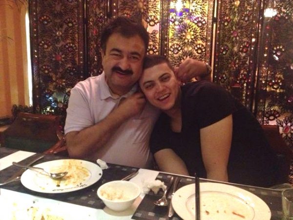 Uyghur comedian Adil Mijit with his son