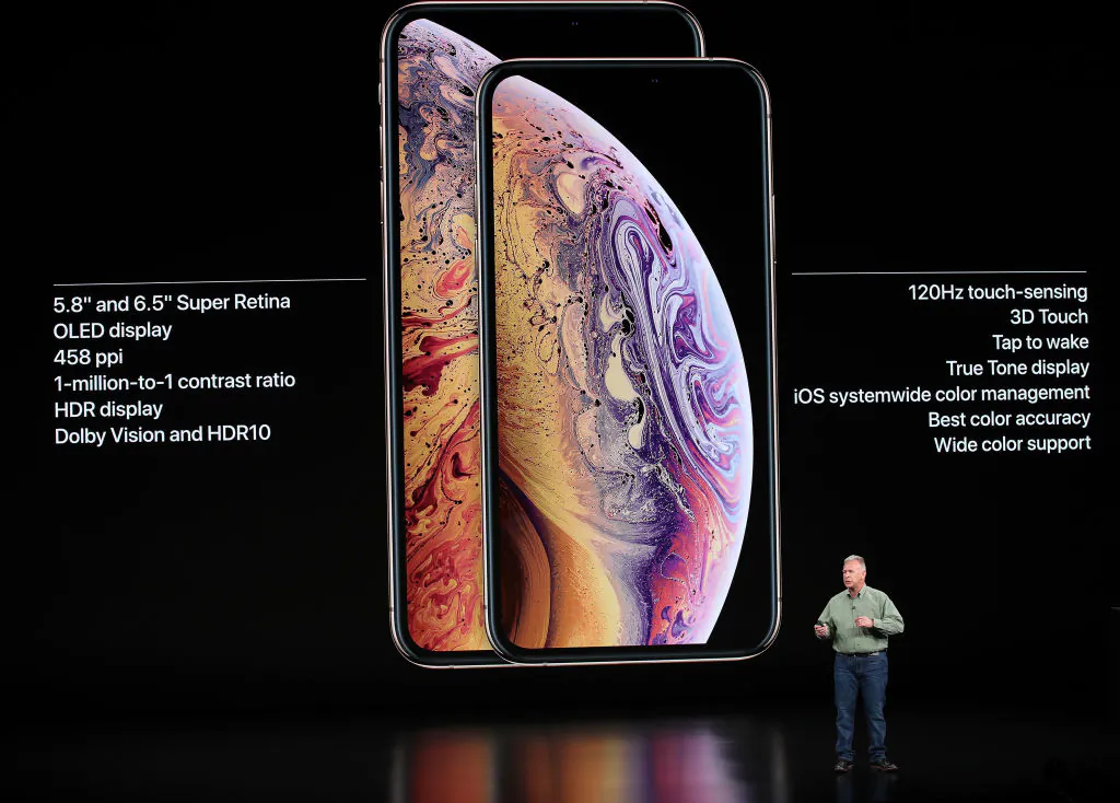 Phil Schiller, senior vice president of worldwide marketing at Apple, speaks at an Apple event at the Steve Jobs Theater in Cupertino, California, on Sept. 12, 2018. Japan Display is a major Apple supplier. (Justin Sullivan/Getty Images)