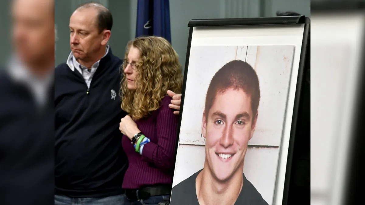 Tim Piazza’s Parents, Jim and Evelyn Piazza, standing next to Tim’s photo, during a news conference in Bellefonte, Pa., on May 5, 2017. (Abby Drey/Centre Daily Times via AP)