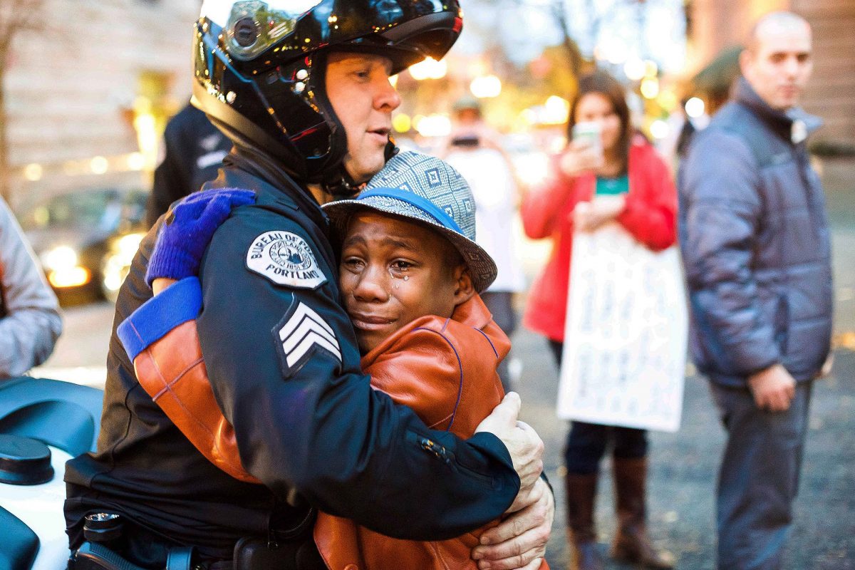 Portland police Sgt. Bret Barnum, left, and Devonte Hart