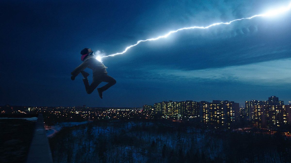 Boy jump off building and says, "Shazam!"