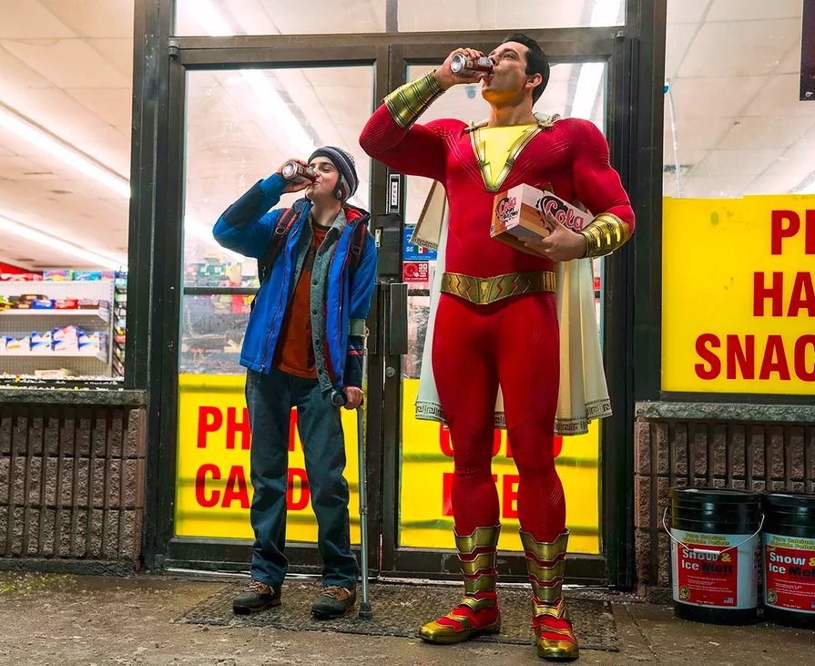 superhero in red suit, boy in blue coat