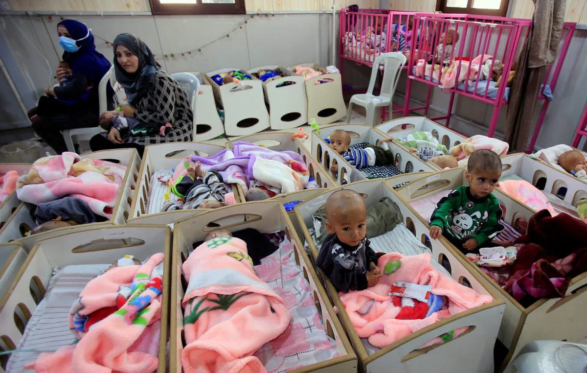 Children of ISIS terrorists, who suffer from malnourishment, are seen at a hospital in Hasaka, northeastern Syria, on April 5, 2019. (Ali Hashisho/Reuters)