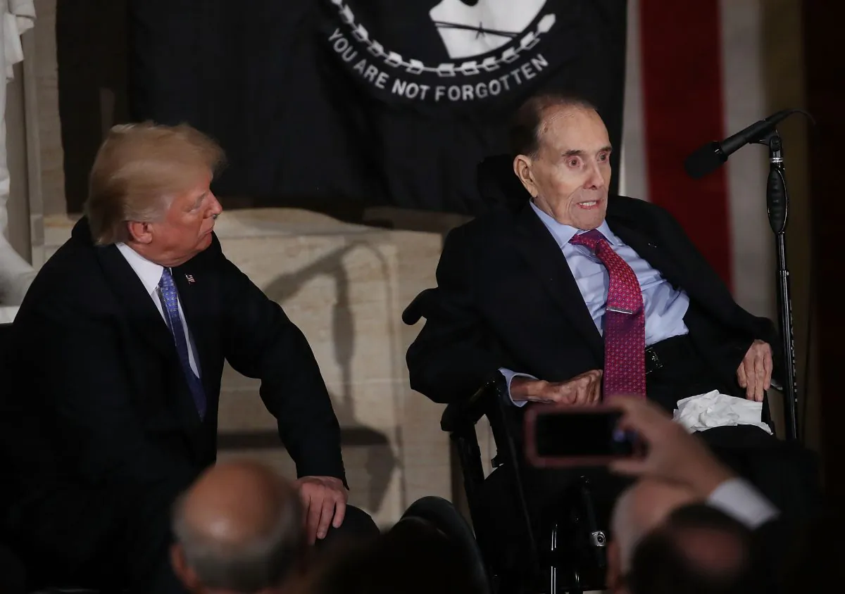 President Donald Trump listens to former Senate Majority Leader Bob Dole (R-KS), speak, after he received the Congressional Gold Medal during a ceremony at the U.S. Capitol, on January 17, 2017 in Washington. (Mark Wilson/Getty Images)