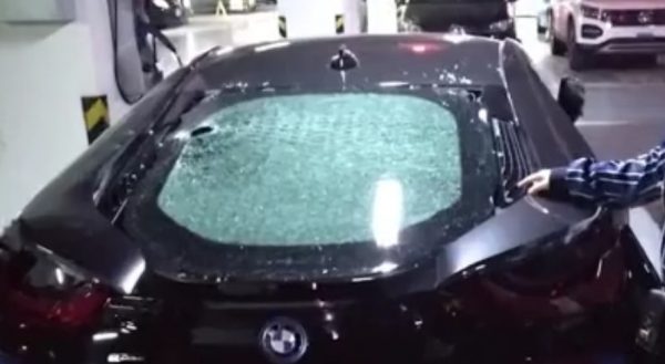 Girl smashes a car
